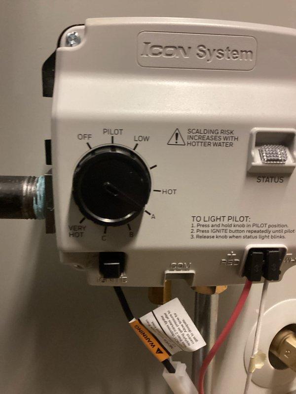 # Plumbing Install - Tanked Water Heater

## Job Description

Completed installation of a new 50-gallon residential tanked water heater with ICON System gas control valve. Removed existing water heater unit and properly positioned new tank on stable platform in basement mechanical room. Connected copper supply and discharge piping with appropriate shut-off valves and pressure relief components. Installed gas line connection to control valve assembly and verified all fittings for proper seal integrity. Mounted ICON System gas control unit featuring adjustable temperature settings (OFF, PILOT, LOW, HOT, VERY HOT) with integrated status indicator and electronic ignition system. Configured pilot light operation and tested ignition sequence for reliable startup. Secured all piping with metal clamps and brackets to ensure structural stability and code compliance. Verified proper venting configuration and clearances around unit. Tested water heater operation through multiple heating cycles to