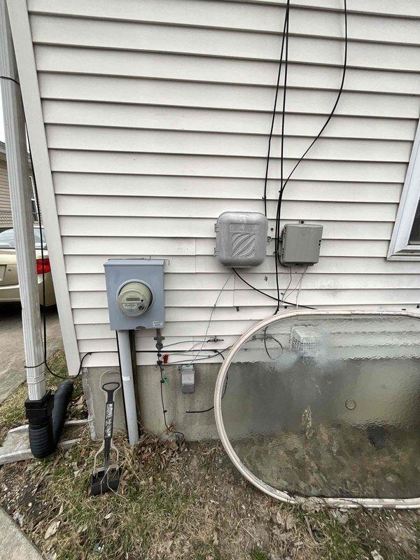 # HVAC Full System Estimate Summary

Conducted comprehensive on-site evaluation for complete HVAC system replacement and duct cleaning services. Customer requesting new central air conditioning unit installation with priority timeline within one month. Performed exterior assessment of existing electrical service entry point, meter location, and utility connections to determine adequate power supply for new equipment installation. Evaluated basement mechanical space including current water heater positioning, available clearances, and wall construction to plan optimal placement for new air handler and associated ductwork modifications. Documented existing utility infrastructure, drainage systems, and basement layout to develop accurate quote for full system replacement including new outdoor condensing unit, indoor air handler, refrigerant lines, electrical upgrades, thermostat installation, and complete duct cleaning service.
