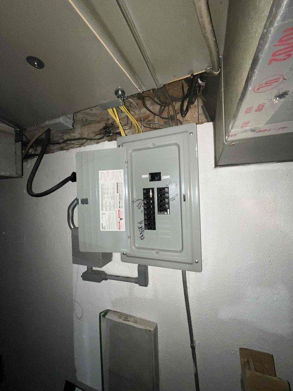 # Electrical Estimate - Generator Installation

Completed site assessment for new whole home generator installation at manufactured home property. Evaluated existing electrical infrastructure including main service panel with exposed breaker configuration and available capacity for generator integration. Inspected gas supply system and confirmed Honeywell gas regulator specifications (MAOP 5 PSI) for compatibility with proposed generator unit. Documented electrical panel location, conduit routing pathways, and utility room configuration to determine optimal placement for automatic transfer switch and generator positioning. Provided comprehensive photographic documentation of existing conditions for accurate material estimation and installation planning.