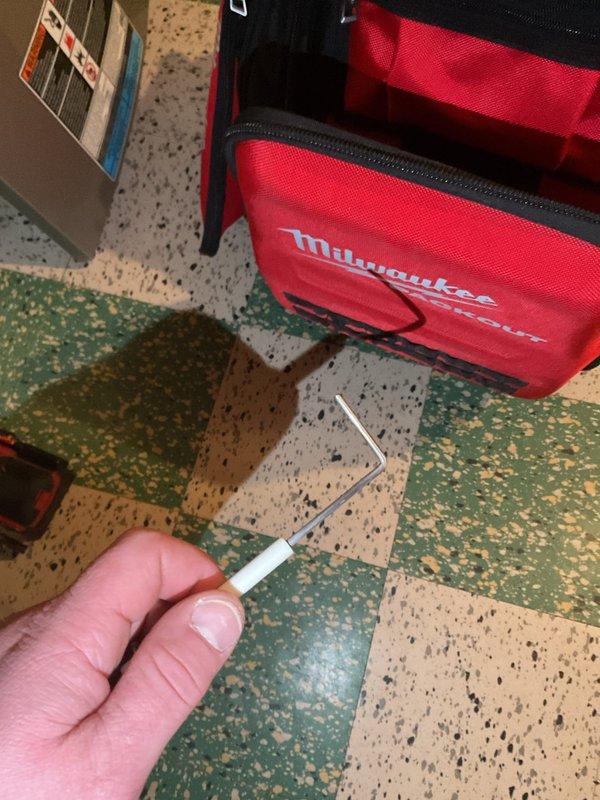 # Service Report

Responded to service call for furnace not running with thermostat displaying "waiting to start" message on 7-year-old unit located in basement. Upon arrival, performed diagnostic evaluation of heating system and thermostat communication. Inspected furnace control board, flame sensor, and ignition system components to identify cause of startup failure.

Investigation revealed faulty flame sensor preventing proper ignition sequence completion. Flame sensor showed signs of carbon buildup and oxidation, causing inadequate signal to control board and preventing burner operation. Removed flame sensor from burner assembly and attempted cleaning with appropriate tools and materials. After assessment, determined sensor was beyond effective cleaning and required replacement for reliable operation.

Installed new flame sensor with proper positioning and secure mounting to ensure optimal flame detection. Verified all electrical connections were tight and properly seated. Tested t