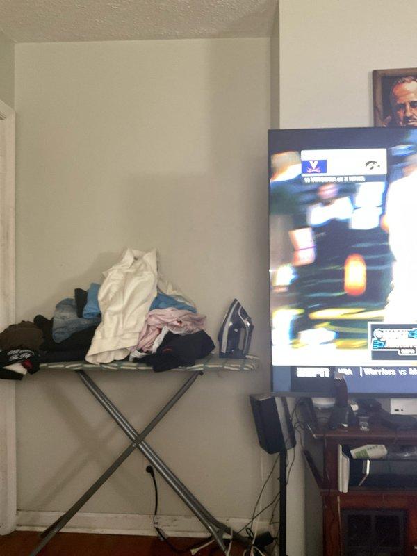 # HVAC Estimate - Mini Split Installation

Conducted on-site assessment for new Mitsubishi mini split system installation in a residential property. Customer requested climate control for two separate rooms: a bedroom and an adjacent living space. Evaluated wall locations and electrical requirements for indoor air handler placement in both zones. Photographed proposed mounting locations above bed area in primary bedroom and identified secondary installation point in living area near entertainment center. Assessed structural considerations, clearance requirements, and optimal positioning for efficient air distribution in both rooms. Provided estimate for complete two-zone mini split system including outdoor condenser unit, indoor wall-mounted air handlers, refrigerant line sets, condensate drainage, and electrical connections.