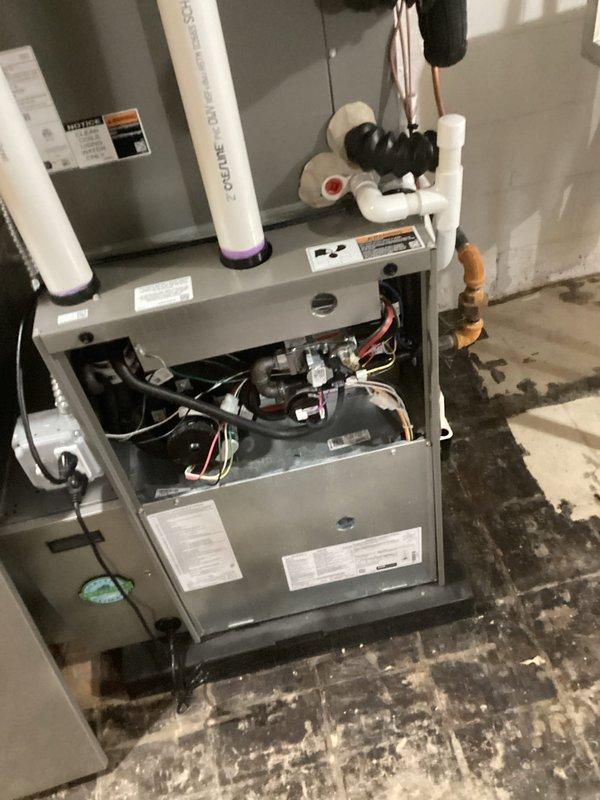 # HVAC Maintenance - AHM Service Summary

Completed scheduled Air Handler Maintenance (AHM) service on residential HVAC system. Performed comprehensive inspection of air handler unit, including internal components, control boards, and wiring harnesses. Replaced furnace filters as part of recurring Air Care Heating maintenance program. Inspected PVC intake and exhaust vent pipes for proper operation and secure connections. Verified refrigerant line insulation integrity and checked copper line connections for signs of wear or leakage. Examined associated plumbing components, valves, and electrical connections in utility area. All system components found operational with no immediate repairs required. Unit left in proper working condition with access panel secured.