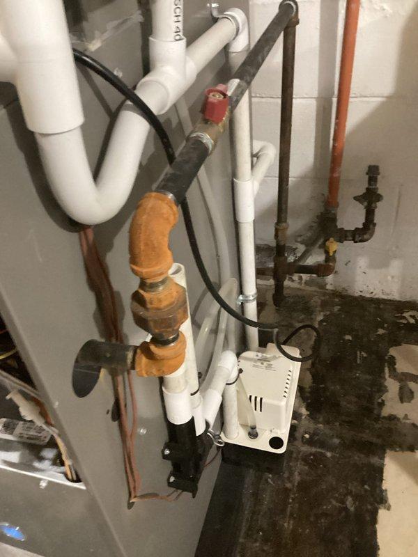 # HVAC Maintenance - AHM Service Summary

Completed scheduled Air Handler Maintenance (AHM) service on residential HVAC system. Performed comprehensive inspection of air handler unit, including internal components, control boards, and wiring harnesses. Replaced furnace filters as part of recurring Air Care Heating maintenance program. Inspected PVC intake and exhaust vent pipes for proper operation and secure connections. Verified refrigerant line insulation integrity and checked copper line connections for signs of wear or leakage. Examined associated plumbing components, valves, and electrical connections in utility area. All system components found operational with no immediate repairs required. Unit left in proper working condition with access panel secured.