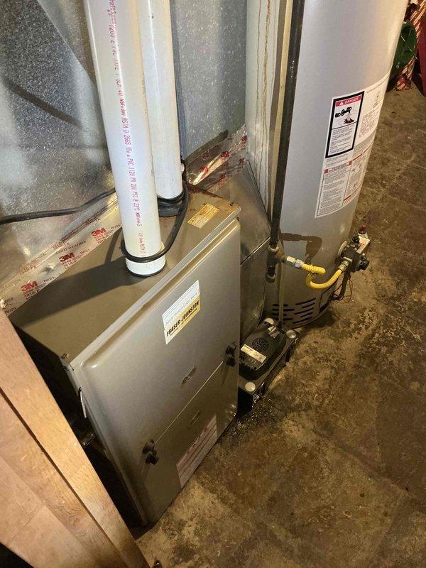 # HVAC Estimate - Full System Job Description

Completed comprehensive site assessment and generated full system replacement quote for residential forced air heating and cooling system. Evaluated existing 12-year-old natural gas furnace and air conditioning unit requiring replacement. Documented current installation including furnace, water heater, gas line connections, PVC venting system with dual exhaust pipes, and existing galvanized metal ductwork throughout the basement mechanical room. Photographed duct runs showing rectangular metal sections with proper sealing at connection points, vertical and angular pathways through exposed framing, and overall system configuration. Assessed basement utility area layout with concrete flooring, unfinished walls with exposed framing, and clearances for equipment access and service. Prepared detailed estimate for complete HVAC system replacement including new high-efficiency furnace and air conditioning unit to meet current heating and cooling 