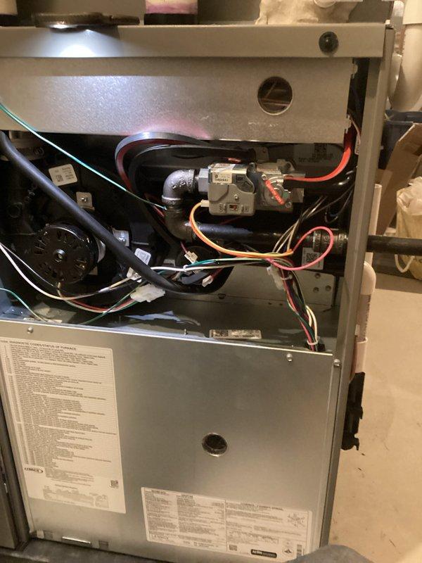 # Annual Heating Maintenance Summary

Completed comprehensive annual heating maintenance on 10-year-old residential gas furnace. Performed full system tune-up including inspection of all major components: heat exchanger, burner assembly, gas valve, inducer motor, blower motor, and electrical connections. Verified proper operation of all safety controls and limit switches. Cleaned burners, inspected flue piping, and tested gas pressure at manifold. Checked and tightened all electrical connections throughout the system. Examined wiring harnesses for signs of wear or damage. Confirmed proper inducer motor operation and verified draft pressure. Inspected blower wheel and motor bearings for wear. Tested thermostat communication and system cycling. Changed air filter and verified adequate airflow throughout system. All components found to be operating within manufacturer specifications with no issues identified. System tested under full heating load and confirmed proper ignition sequence, fl