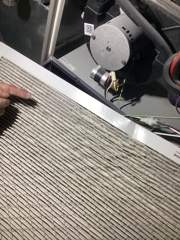 Completed scheduled Air Care Heating and Cooling maintenance on air handler unit. Performed comprehensive system inspection including internal components, blower motor assembly, refrigerant lines, electrical connections, and control board. Removed and inspected heavily soiled air filter showing significant dust accumulation; replaced filter to restore proper airflow and system efficiency.