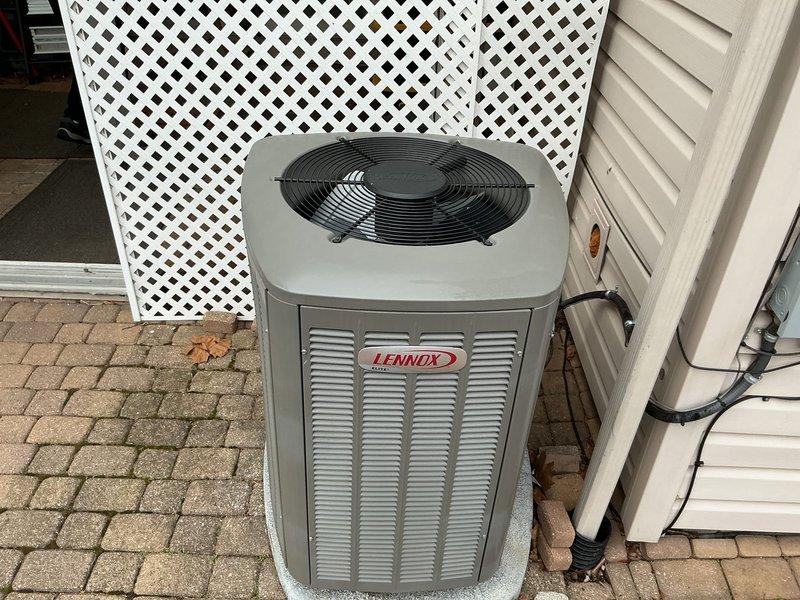 # ComfortGuard Maintenance Package - Service Summary

Completed comprehensive preventive maintenance service on residential Lennox heating and cooling system. Performed thorough inspection and servicing of outdoor condenser unit, including coil cleaning, electrical connection verification, and refrigerant level assessment. Unit found to be in excellent operational condition with no deficiencies noted. Indoor Lennox digital thermostat inspected and confirmed functioning properly, displaying accurate temperature readings and system status with heating mode active at 72°F setpoint. All system components operating within manufacturer specifications with no immediate repairs required.