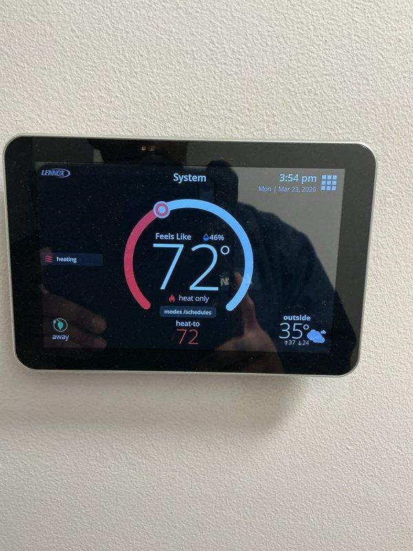 # ComfortGuard Maintenance Package - Service Summary

Completed comprehensive preventive maintenance service on residential Lennox heating and cooling system. Performed thorough inspection and servicing of outdoor condenser unit, including coil cleaning, electrical connection verification, and refrigerant level assessment. Unit found to be in excellent operational condition with no deficiencies noted. Indoor Lennox digital thermostat inspected and confirmed functioning properly, displaying accurate temperature readings and system status with heating mode active at 72°F setpoint. All system components operating within manufacturer specifications with no immediate repairs required.