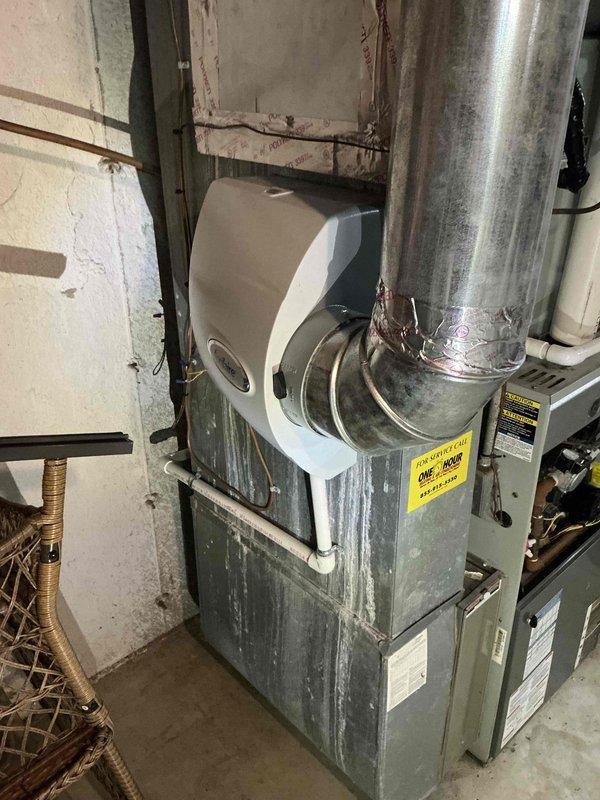 # HVAC System Replacement Estimate

Conducted comprehensive assessment of existing 20-year-old residential HVAC system including furnace and air conditioning unit requiring immediate replacement. Documented current equipment conditions through detailed photography of evaporator coil assembly in attic space showing moisture accumulation and condensation patterns, as well as basement furnace installation with attached humidifier unit exhibiting visible wear, dust accumulation, and age-related deterioration. Prepared detailed replacement quote for new two-way furnace and air conditioning system to address failed equipment and restore reliable climate control to residential property.