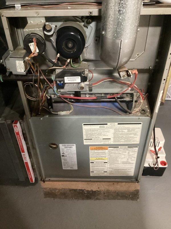 # HVAC Maintenance - AHC Service Summary

Completed comprehensive Air Handler Check (AHC) maintenance service covering both heating and cooling system components as part of recurring preventive maintenance program. Performed thorough inspection of residential furnace unit, accessing internal components through upper cabinet panel to evaluate blower motor assembly, electrical connections, ignition system, and control module functionality. All mechanical and electrical components were inspected and found to be operating within normal parameters.

Identified severely clogged air filter with excessive accumulation of dust, dirt, and particulate matter throughout the diamond-pattern mesh screen, which was significantly restricting airflow and reducing system efficiency. Removed and replaced the heavily contaminated filter element to restore proper airflow and system performance. The extent of debris buildup indicated the filter had exceeded its recommended service interval, which can lead t