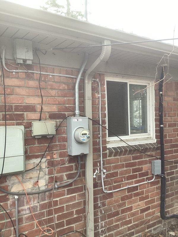 # HVAC Install - Complete System

## Job Description

Completed full HVAC system installation including 70,000 BTU furnace and 2-ton air conditioning unit with rear discharge configuration. Installed new humidifier and established dedicated electrical circuit to support system requirements. Secured all necessary mechanical and electrical permits prior to installation. System components properly labeled with manufacturer identification and safety warnings per code requirements. Exterior electrical service modifications completed including conduit installation and meter connections to accommodate new HVAC load.