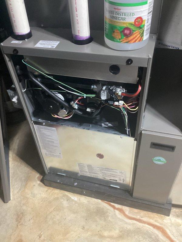 # HVAC Maintenance - AHM Service Report

Completed annual heating maintenance on residential furnace system as part of customer's maintenance membership plan. Performed comprehensive tune-up inspection with furnace access panel removed to assess all internal components including blower motor assembly, electrical connections, wiring harnesses, circuit boards, and mechanical systems. Verified proper operation of all safety controls and electrical circuits throughout the unit.

Conducted standard preventive maintenance procedures on the heating system. Inspected ductwork connections and air handler plenum for proper installation and secure fittings. Examined PVC venting system including condensate drain lines, noting proper installation with visible primer markings at joints indicating code-compliant assembly. 

Performed routine maintenance tasks including inspection of blower motor components and verification of all wire connections and harnesses for secure attachment and proper routing