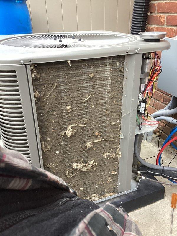 # HVAC Maintenance Service Summary

Performed comprehensive annual heating and cooling maintenance on residential split system. Conducted thorough inspection of gas furnace assembly, verifying proper operation of blower motor, heat exchanger, and ignition components. Checked electrical connections and control board functionality. All furnace safety mechanisms tested and confirmed operational.

Inspected outdoor condensing unit and identified heavily contaminated condenser coil with significant accumulation of dirt, dust, and debris restricting airflow. Performed complete coil cleaning to restore proper heat transfer efficiency and system performance. Removed access panel and thoroughly cleaned coil fins to remove built-up contamination throughout entire coil surface.

Verified refrigerant pressures and system charge. Inspected electrical connections at outdoor unit and confirmed secure wiring. Tested capacitor and contactor operation. Evaluated fan motor performance and lubricated as n