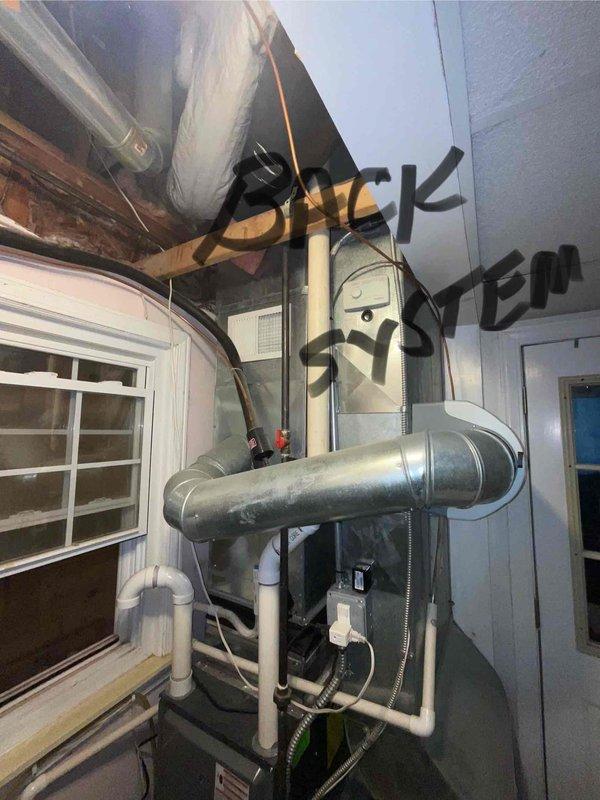 # HVAC Full System Estimate Summary

Completed comprehensive evaluation of 15-year-old residential air conditioning system for customer seeking replacement within current season. Assessed dual-zone HVAC installation including front and back systems located in basement mechanical room. Documented existing equipment configuration, ductwork layout, electrical connections, and overall system condition. Photographed both furnace units, associated ductwork, control panels, and mechanical room infrastructure to support replacement recommendations. Provided professional assessment of aging equipment and discussed options for full system replacement to address reliability concerns and improve energy efficiency.