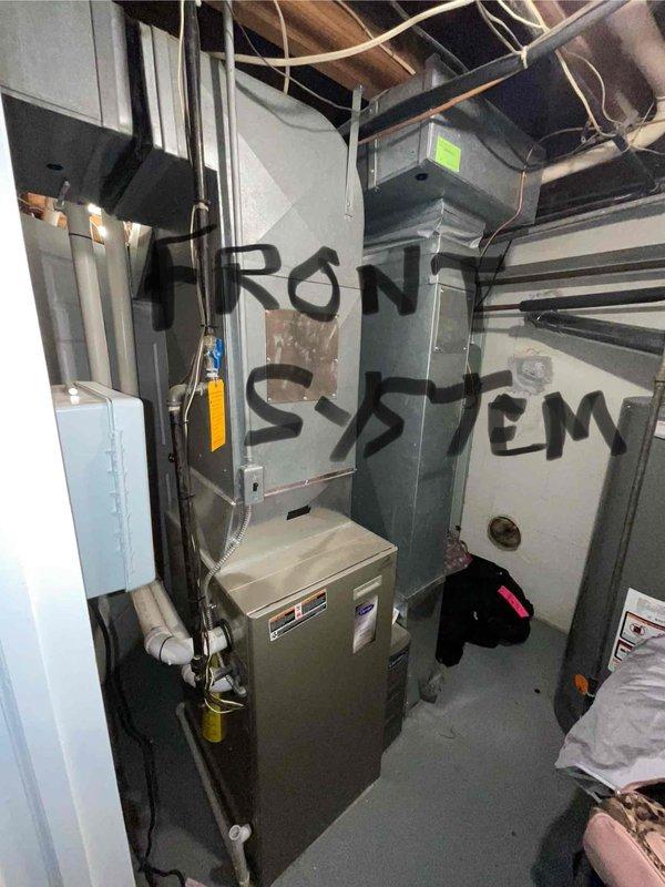 # HVAC Full System Estimate Summary

Completed comprehensive evaluation of 15-year-old residential air conditioning system for customer seeking replacement within current season. Assessed dual-zone HVAC installation including front and back systems located in basement mechanical room. Documented existing equipment configuration, ductwork layout, electrical connections, and overall system condition. Photographed both furnace units, associated ductwork, control panels, and mechanical room infrastructure to support replacement recommendations. Provided professional assessment of aging equipment and discussed options for full system replacement to address reliability concerns and improve energy efficiency.