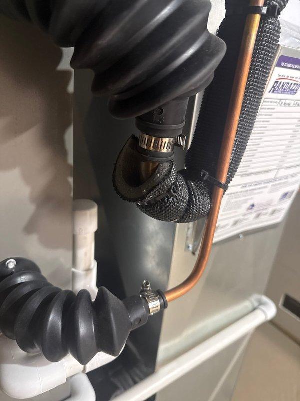 Completed violation repair callback on recently installed HVAC system to address unsealed insulation at evaporator coil elbow and flex connection points. Properly sealed all insulation gaps at evaporator connections and secured flexible duct boots to coil assembly per code requirements, ensuring complete thermal barrier and proper system operation.