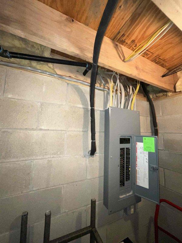Provided comprehensive electrical estimate for new whole home Kohler generator installation at a 2-story residential property. Assessed existing electrical service panel located in unfinished basement with exposed concrete block walls, evaluated current electrical infrastructure including main panel configuration and available capacity, and documented site conditions to determine optimal generator placement and integration requirements for complete home backup power system.