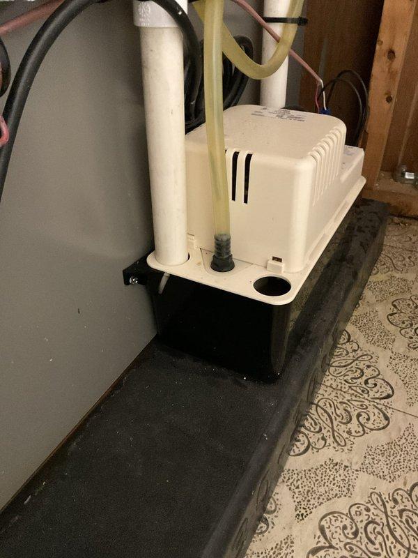 Responded to service call for condensate pump continuously running and causing water leak onto floor. Upon arrival, diagnosed malfunctioning condensate pump that failed to shut off properly, resulting in overflow conditions. Performed diagnostic evaluation of the pump assembly, reservoir, and associated drainage components to identify the failure mode causing the continuous operation and water discharge onto the tile flooring beneath the air handler unit.