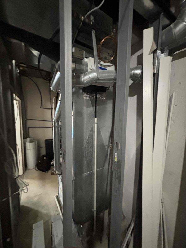 Provided comprehensive estimate for replacement of 20+ year old furnace and air conditioning system located in basement mechanical room as part of promotional offer. Existing natural gas furnace and AC unit currently operational but nearing end of service life. Assessment included evaluation of existing ductwork, electrical connections, condensate drainage, and venting requirements for proper sizing and installation planning of new high-efficiency HVAC system.