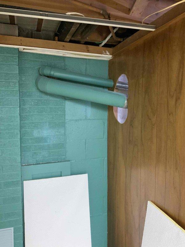 Conducted comprehensive site evaluation for complete HVAC system installation in residential property currently without existing heating or cooling equipment. Assessed basement mechanical room layout, existing utility infrastructure including water heater and plumbing systems, and evaluated available space for new furnace and air conditioning equipment placement. Documented current conditions of unfinished basement area with wood-paneled walls, exposed joists, and concrete flooring to determine optimal equipment configuration and ductwork routing. Photographed existing utility connections, electrical panel location, and structural considerations for new system installation. Provided detailed equipment recommendations and installation specifications for full heating and cooling system to be scheduled for installation at end of March.