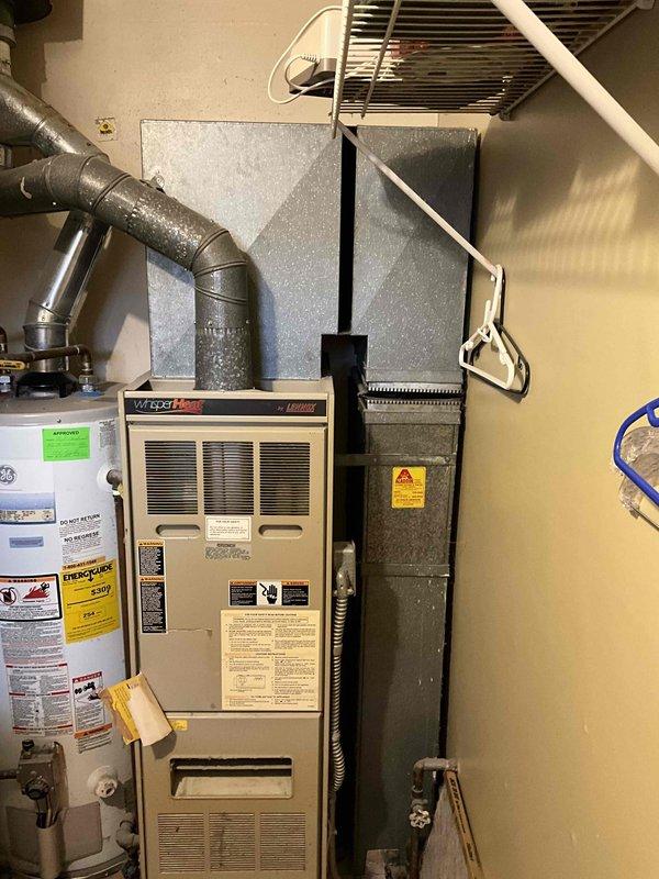 Conducted full system assessment for HVAC replacement estimate on 16-year-old gas furnace and existing ductwork system. Evaluated current equipment condition, measured existing duct configuration, documented mechanical room layout and clearances, and photographed furnace, water heater proximity, supply plenum connections, and overhead ductwork routing to provide comprehensive replacement system specifications.