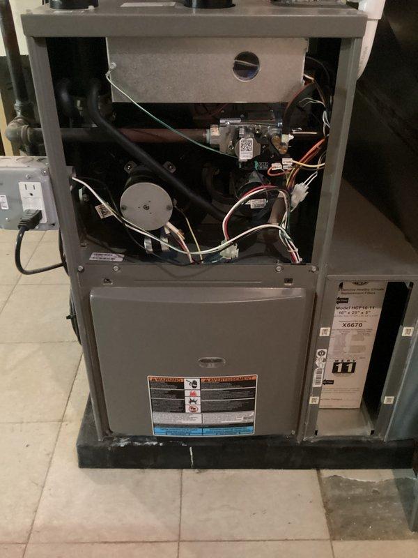 Completed annual furnace maintenance on basement-located HDF90-11 model unit as part of preventative care membership. Performed comprehensive tune-up including inspection of blower motor assembly, gas valve connections, electrical wiring, and all internal components with access panel removed. Inspected and evaluated integrated humidifier unit with mesh filter pad and associated PVC drainage lines, confirming all systems operating within normal parameters with no issues identified.