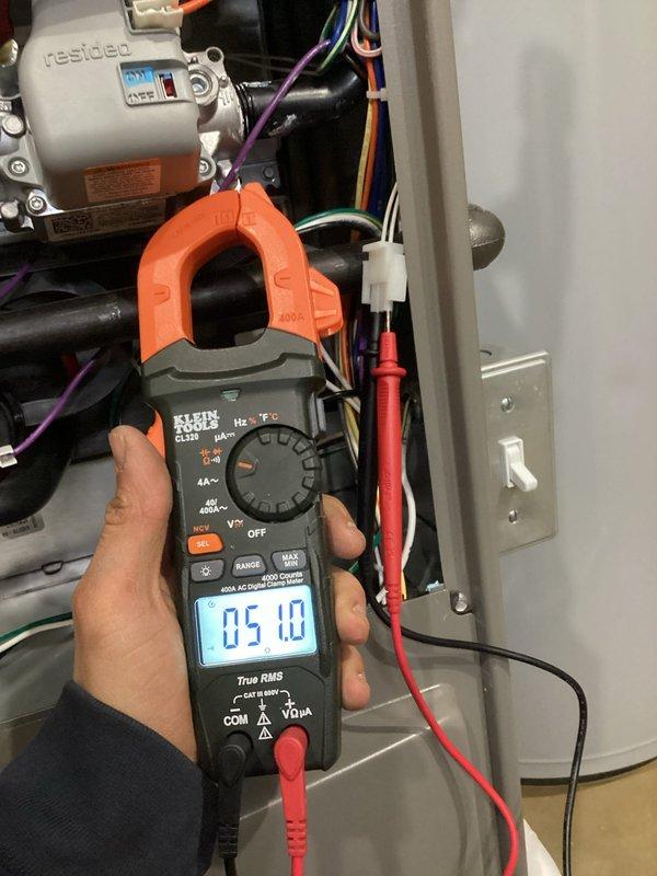 # Annual Furnace Maintenance Completed

Performed comprehensive annual heating maintenance on a 10-year-old residential furnace system per membership agreement. Conducted complete system inspection with front panel removal to access all internal components. Verified proper operation of draft inducer motor assembly, blower motor, and all electrical connections. Performed electrical diagnostics using clamp meter to measure current draw on system components, confirming all readings within manufacturer specifications. Inspected and tested control board, wiring harness, and safety devices. System found operating properly with no deficiencies noted. Unit returned to normal service.