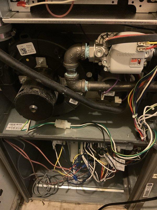Completed comprehensive annual furnace maintenance and tune-up on residential heating system. Performed full system inspection including visual examination of all internal components, blower motor assembly, capacitor, gas valve connections, and electrical control board. Verified proper operation of Resideo control module, inspected all electrical connections and wiring harnesses for secure termination, checked copper gas piping and brass fittings for integrity, and confirmed all safety labels and component identification tags were present and legible. All components found operating within normal parameters with no immediate repairs required. System tested and left in proper working condition.