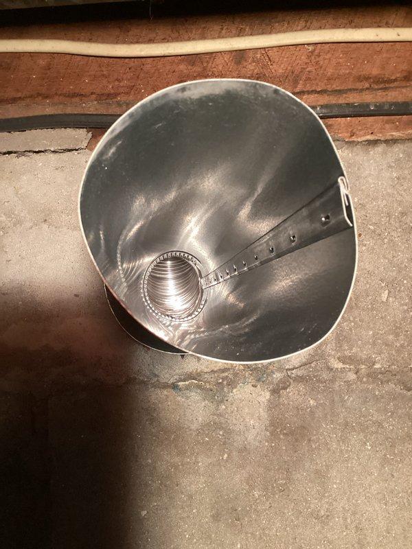 Responded to callback for chimney liner installation and water heater anode rod replacement. Assessed severely pitched roof with paneling surface near chimney and determined boom lift will be required for safe access due to low traction conditions. Attempted anode rod replacement to address rotten egg odor complaint, but Michigan basement configuration with low ceiling clearance (approximately 2-3 feet above tank) prevented removal of rod without full tank extraction. Documented site conditions with photos showing chimney penetration and clearance constraints. Recommended complete water heater removal and outdoor servicing to replace anode rod, as vertical space is insufficient for in-place rod extraction.