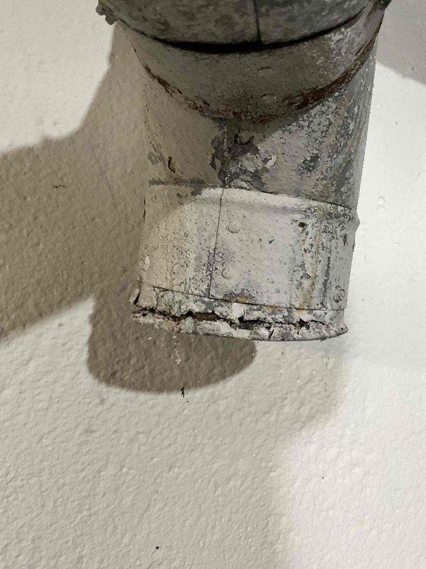 Performed full system estimate for 1700 square foot ranch home with full basement. Evaluated existing 1999 HVAC system with failed furnace control board and determined 80% efficiency furnace is worn out and not cost-effective to repair. Air conditioning unit remains operational. Documented natural gas meter installation and deteriorated ductwork showing significant structural damage including horizontal cracking, paint failure, and corrosion. Provided replacement system options for complete HVAC upgrade.