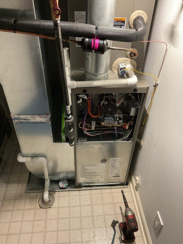 Completed annual furnace maintenance and tune-up on two residential furnace units. Performed comprehensive inspection of all internal components including blower motor assembly, gas valve connections, electrical wiring, control board, and safety mechanisms. Verified proper operation of both systems with access panels opened for thorough examination of burner components, heat exchangers, and ventilation connections. Documented system conditions with photographs showing clean interior components, properly routed wiring harnesses, and operational pressure readings. All systems operating within normal parameters with no issues identified during maintenance visit.