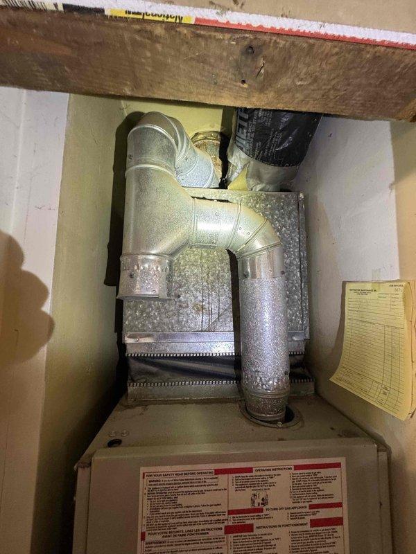 Provided comprehensive estimate for HVAC system replacement on a 1998 16-year-old Kenmore furnace with failed heat exchanger and defective inducer motor, rendering the unit inoperable. Documented existing system conditions through detailed photography showing moisture accumulation on ductwork, aged electrical components, and overall cabinet interior. Prepared multiple replacement options including full system replacement and comparison pricing for repair versus AC replacement to accommodate immediate replacement needs.
