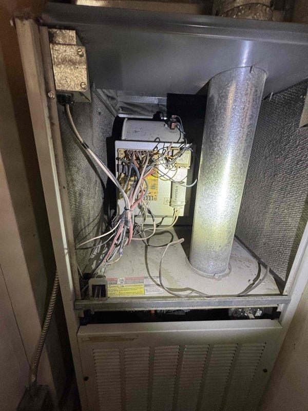 Provided comprehensive estimate for HVAC system replacement on a 1998 16-year-old Kenmore furnace with failed heat exchanger and defective inducer motor, rendering the unit inoperable. Documented existing system conditions through detailed photography showing moisture accumulation on ductwork, aged electrical components, and overall cabinet interior. Prepared multiple replacement options including full system replacement and comparison pricing for repair versus AC replacement to accommodate immediate replacement needs.