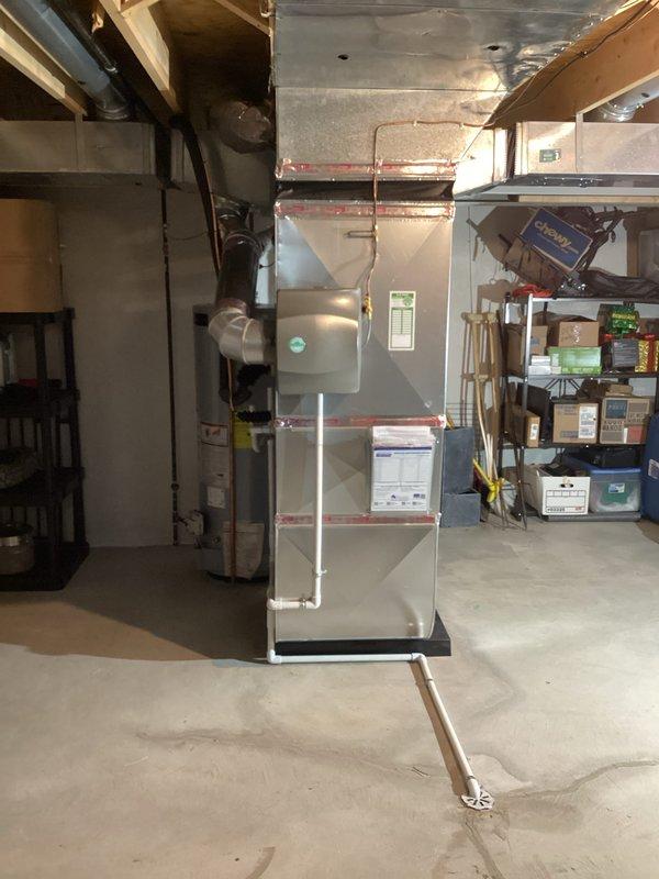 Completed full HVAC system installation in basement mechanical room, including 90,000 BTU gas furnace and 3-ton air conditioning unit with rear discharge configuration. Installed humidifier, reconnected all utilities, and routed ductwork through ceiling joists. Requested mechanical and electrical permits prior to installation. All utility rebate documentation collected for processing with gas and electric providers.