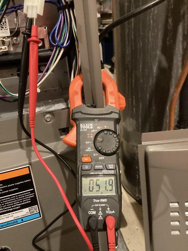 Completed annual furnace maintenance and tune-up on residential gas forced-air heating system. Performed comprehensive inspection of all internal components including blower motor, electrical connections, control boards, and safety systems. Verified proper electrical operation using digital multimeter, confirming voltage readings within manufacturer specifications at 5.19V on tested circuit. All wiring connections secure, system operating safely and efficiently with no deficiencies noted.