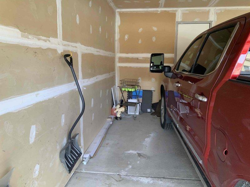 Conducted comprehensive site assessment for 240V EV charging station installation at residential side-by-side condominium property. Evaluated existing electrical infrastructure in garage, documented current conditions including unfinished drywall and available wall space for charger mounting, and photographed installation location to determine optimal placement for charging equipment. Provided detailed quote encompassing charger unit specifications, installation requirements, and warranty coverage for homeowner review.