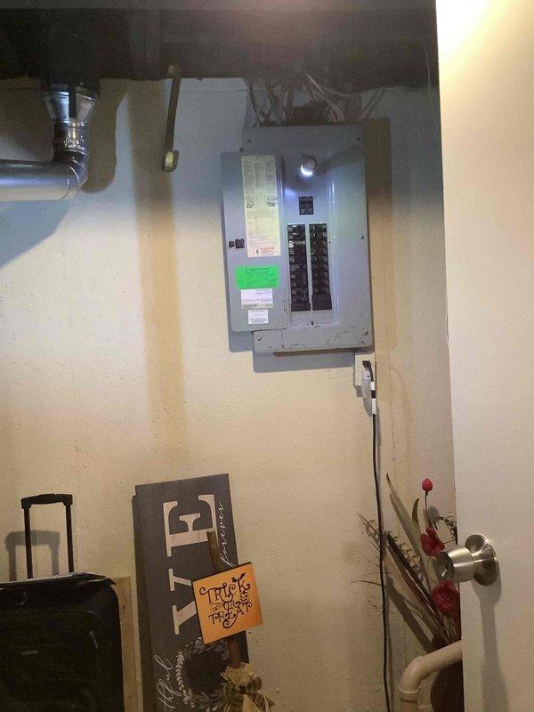 Conducted comprehensive site evaluation for whole house Generac generator installation. Assessed existing electrical infrastructure including main service panel with dual rows of circuit breakers, evaluated available space in utility area for generator placement, and documented current electrical configuration. Inspected plumbing and HVAC systems in proximity to proposed installation location to determine optimal positioning and clearance requirements. Photographed electrical panel specifications and utility room layout to develop accurate material list and labor estimate for automatic transfer switch integration and generator connection to existing residential electrical system.