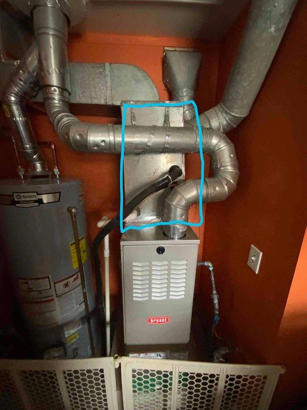 Conducted on-site evaluation of residential HVAC system for new homeowners following report of burned-out air conditioning unit from previous owner. Inspected 15-year-old AC system and existing Bryant furnace installation located in utility closet with A.O. Smith water heater. Assessed ductwork configuration, equipment condition, and system compatibility for replacement recommendations. Documented existing mechanical room layout and equipment specifications through photographic records to prepare comprehensive replacement estimate for complete AC system installation.