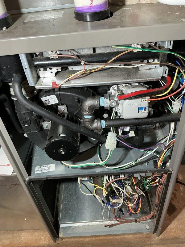 Completed annual furnace maintenance and tune-up on brand new heating system operating under Air Care Membership with no reported issues. Performed comprehensive inspection of all internal components including blower motor assembly, electrical connections, gas valve, and control wiring throughout the unit. Verified proper operation of all mechanical and electrical systems, documented equipment condition with photos showing clean installation and organized wire routing, and confirmed system is functioning within manufacturer specifications.