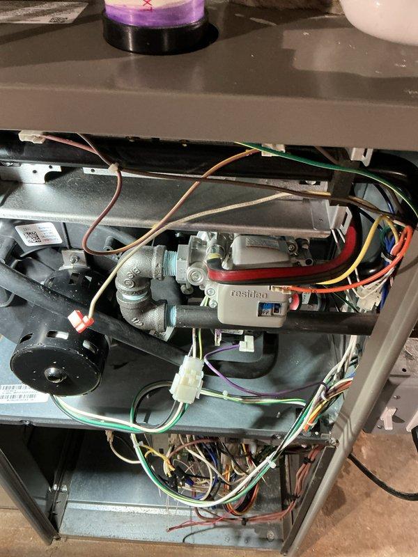 Completed annual furnace maintenance and tune-up on brand new heating system operating under Air Care Membership with no reported issues. Performed comprehensive inspection of all internal components including blower motor assembly, electrical connections, gas valve, and control wiring throughout the unit. Verified proper operation of all mechanical and electrical systems, documented equipment condition with photos showing clean installation and organized wire routing, and confirmed system is functioning within manufacturer specifications.