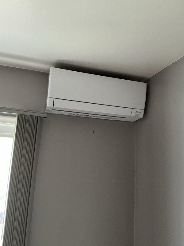 Successfully installed a ductless mini-split air conditioning system with indoor wall-mounted unit positioned high on the interior wall near the ceiling. Installation included mechanical and electrical work with new dedicated circuit to support the system. All necessary permits were obtained prior to installation, and the unit was mounted securely in accordance with manufacturer specifications and local code requirements.