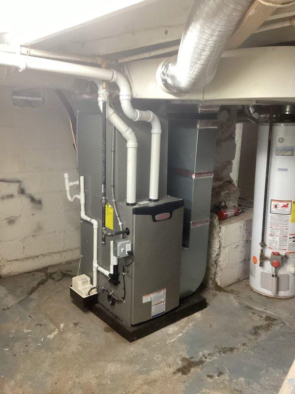 Completed full HVAC system installation in basement mechanical room, including 70,000 BTU furnace and 2.5 ton air conditioning unit with rear discharge configuration. Installed new furnace on platform with proper PVC venting, connected metallic ductwork with insulated liner, and ran new dedicated electrical circuit to equipment. Obtained mechanical and electrical permits prior to installation, and all required paperwork has been finalized.