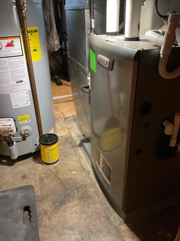 Completed annual furnace maintenance and tune-up on Lennox brand heating system located in basement utility area. Performed comprehensive inspection of furnace components, verified proper operation of all safety controls, cleaned burner assembly, checked and adjusted gas pressure, inspected heat exchanger for cracks or deterioration, tested blower motor operation, replaced air filter, and verified proper venting through PVC exhaust system. All systems tested and operating within manufacturer specifications with no deficiencies noted.