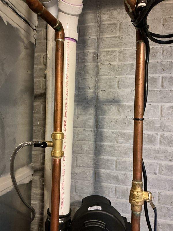 Installed a 50-gallon power vent water heater in basement utility area with proper copper supply line connections, brass shut-off valves, and pressure relief valve. Completed all mechanical connections including top-mounted circulation pump, secured piping with wall brackets, and integrated unit with existing HVAC system. Obtained necessary permits and ensured all installations met code requirements with proper venting and safety components in place.