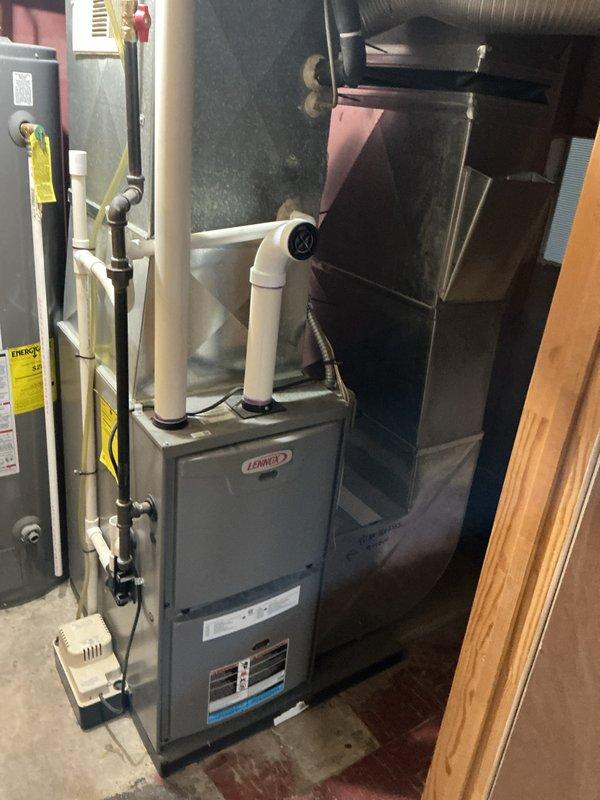Completed annual furnace maintenance on 10-year-old Lennox gas furnace as part of Air Care Membership tune-up service. Performed comprehensive system inspection including burner assembly cleaning, flame sensor maintenance, heat exchanger examination, blower motor lubrication, air filter replacement, and combustion analysis. Verified proper operation of all safety controls, tested thermostat functionality, inspected venting system and PVC intake/exhaust pipes for proper installation and clearances, and confirmed gas pressure within manufacturer specifications. System operating efficiently with no deficiencies noted.