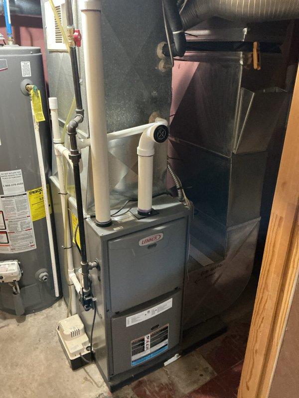 Completed annual furnace maintenance on 10-year-old Lennox gas furnace as part of Air Care Membership tune-up service. Performed comprehensive system inspection including burner assembly cleaning, flame sensor maintenance, heat exchanger examination, blower motor lubrication, air filter replacement, and combustion analysis. Verified proper operation of all safety controls, tested thermostat functionality, inspected venting system and PVC intake/exhaust pipes for proper installation and clearances, and confirmed gas pressure within manufacturer specifications. System operating efficiently with no deficiencies noted.