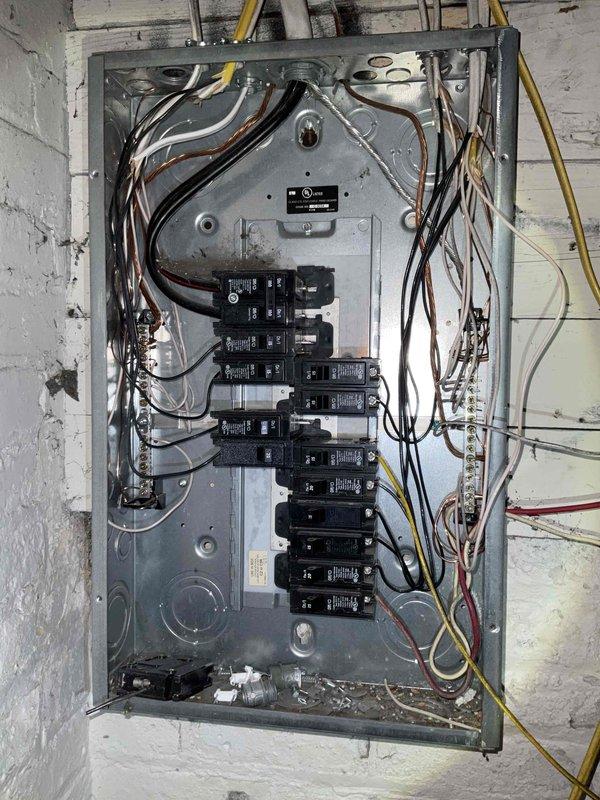 Conducted site assessment for HVAC replacement estimate at four-level residential property requiring new furnace and air conditioning system with major ductwork modifications. Evaluated existing 20+ year old natural gas heating system located in basement and third-floor unit, documented electrical panel infrastructure and utility connections, and confirmed current equipment operational status prior to generating replacement proposal.