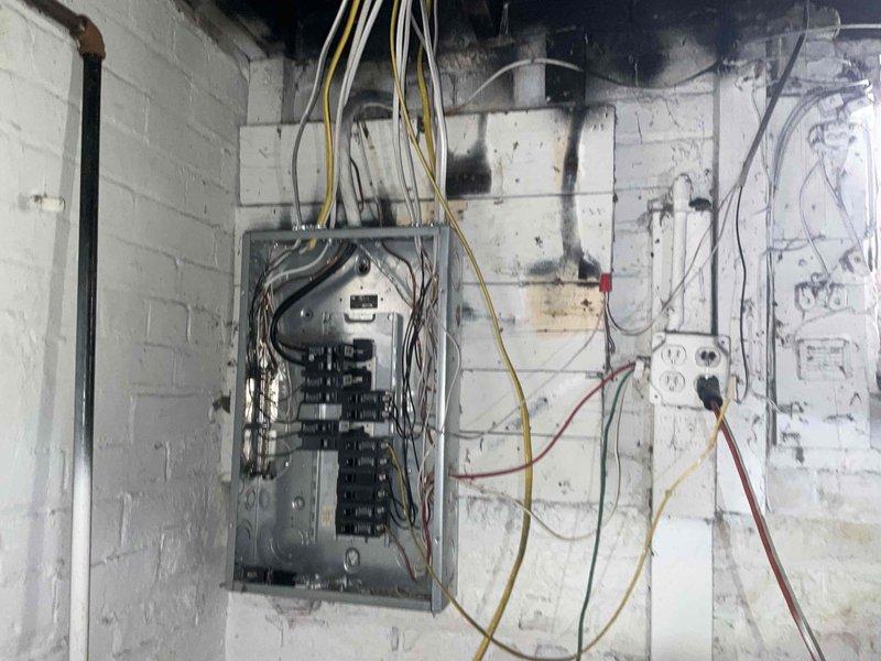 Conducted site assessment for HVAC replacement estimate at four-level residential property requiring new furnace and air conditioning system with major ductwork modifications. Evaluated existing 20+ year old natural gas heating system located in basement and third-floor unit, documented electrical panel infrastructure and utility connections, and confirmed current equipment operational status prior to generating replacement proposal.