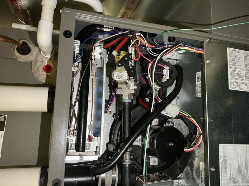 Completed annual furnace tune-up and maintenance on residential HVAC system during evening appointment window. Performed comprehensive inspection of blower motor assembly, electrical connections, and control boards; verified proper operation of all mechanical components including dual blower fans and condensate drainage system. All colored wire connections, relay modules, and circuit boards inspected and confirmed secure with no issues found; unit operating within normal parameters and ready for upcoming heating season.