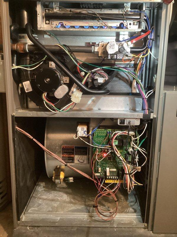 Completed annual furnace maintenance on a 10-year-old heating system as part of scheduled preventative service. Performed comprehensive tune-up including inspection of burner assembly, flame sensor, blower motor, draft inducer, and control boards. Verified thermostat operation and settings, confirmed system heating to setpoint of 74°F with proper humidity levels at 34%. All internal components inspected and found to be in operational condition with proper wiring connections intact.